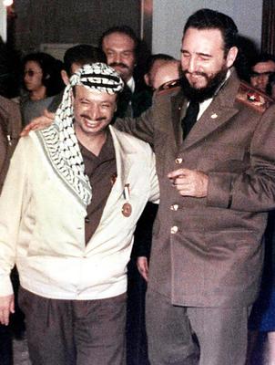 Palestinian leader Yasser Arafat, left, with Fidel Castro.