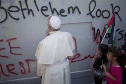 From the AP: "Pope Francis prays at Israel's separation barrier on his way to a mass in Manger Square next to the Church of the Nativity, traditionally believed to be the birthplace of Jesus Christ in the West Bank city of Bethlehem on Sunday, May 25, 2014. Francis called the Israeli-Palestinian stalemate "unacceptable" as he landed Sunday in the West Bank town of Bethlehem in a symbolic nod to Palestinian aspirations for their own state. " (AP Photo/Ariel Schalit)