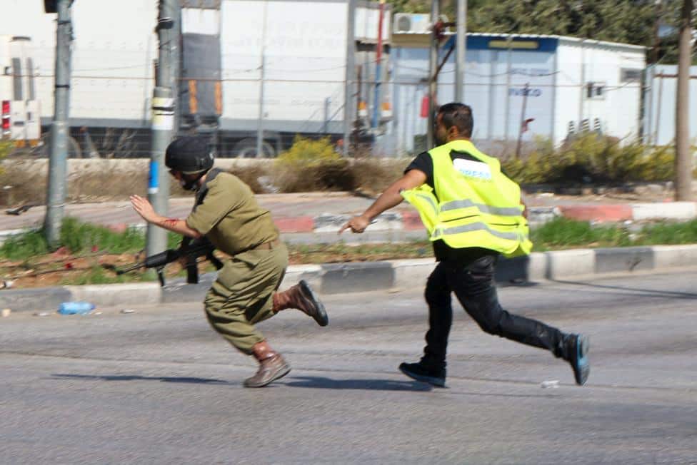 journalist-chasing-soldier.jpg