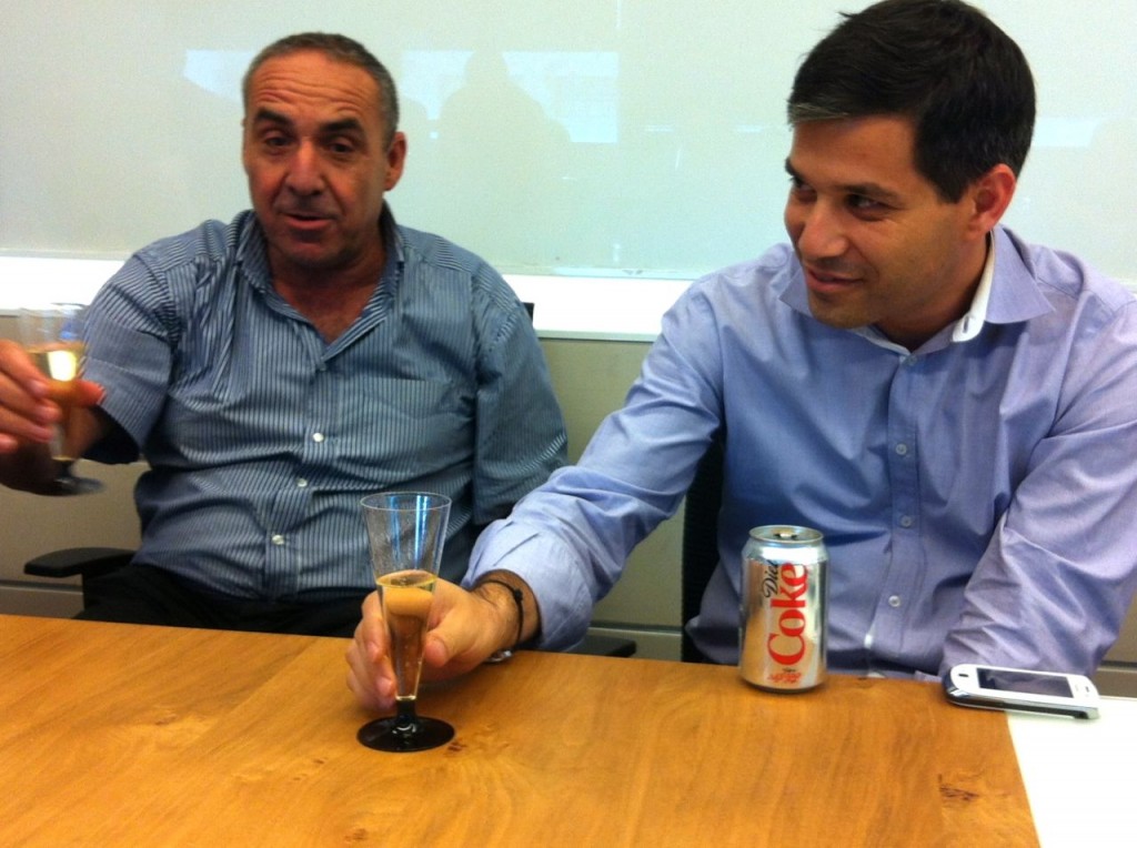shai agassi moshe kaplinsky raising a toast