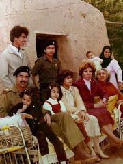 Saddam Hussein visits the clay home in which he was born in the town of
Tikrit with (L-R) his sons Uday and Qusay, daughters Hala and Ragad,
and first wife Sajda Kher Alain (4th R) in an undated photo from the
private archive of an official photographer for the regime.
Photo: Reuters