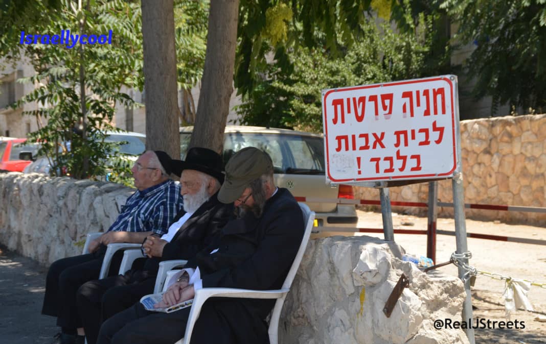 image men sleeping on public bench