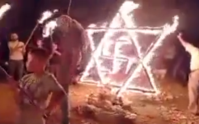 palestinians set fire to star of david