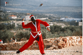 sling shot rcok thrower dressed as santa