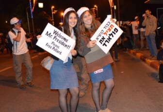 protest banners held by two girls