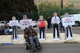 image disabled man, picture Jerusalem protest, image unusual protest signs