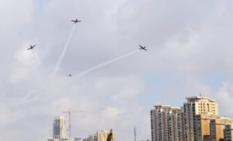 Four planes flying over skyline