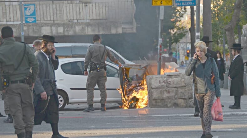 image demonstration Jerusalem, photo burning trash bin, picture fire