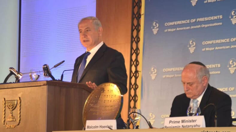 photo Israel prime minister speaking, picture B Netanyahu speaking, image Presidents Conference main evnet.