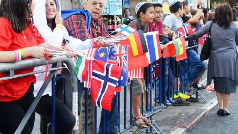 Small international flags, image people with many flags, flags of many countries image