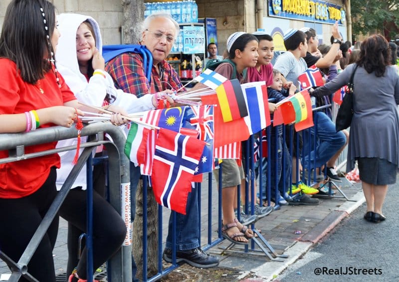 Small international flags, image people with many flags, flags of many countries image