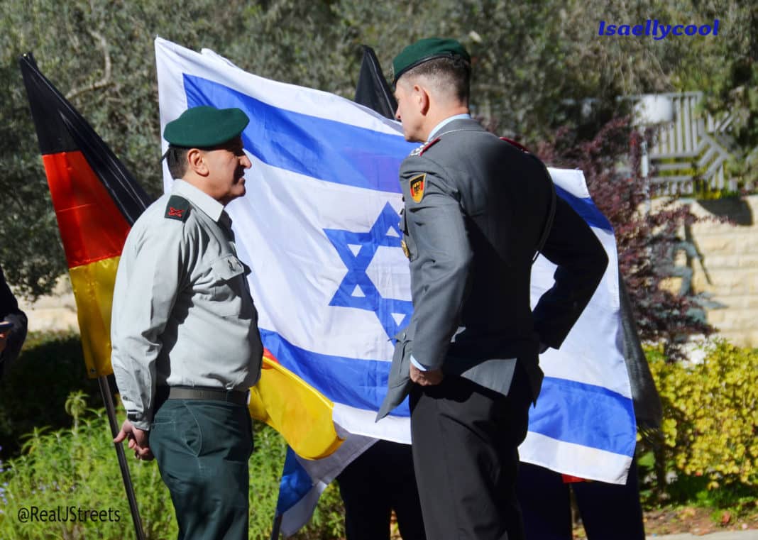 Israeli and German military officers talking