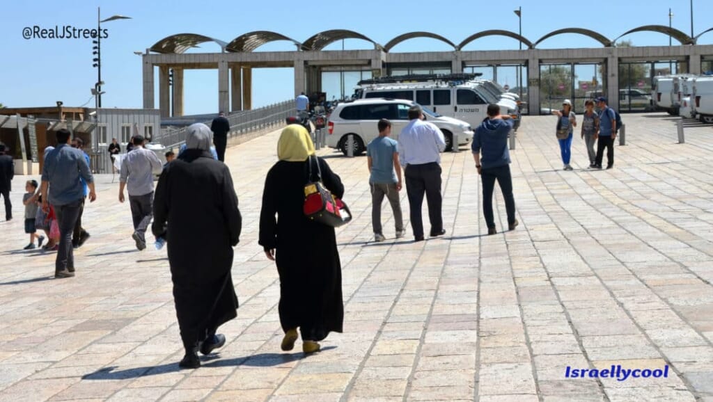 Muslims walking through Kotel plaza on Friday after prayers