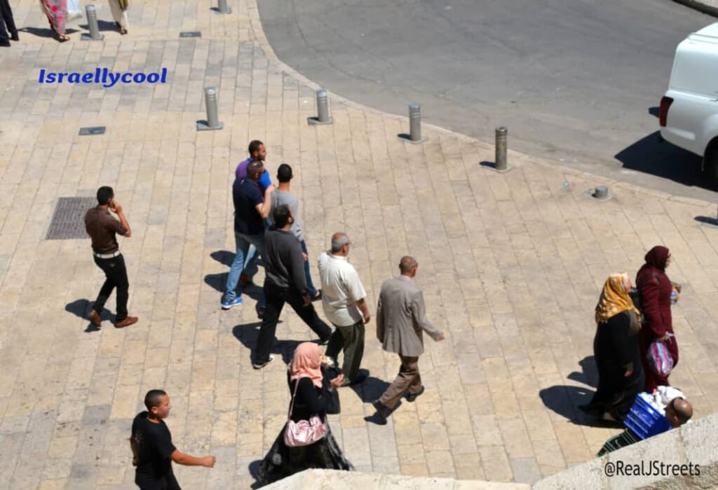 Walking away after Muslim Friday prayers out side Western Wall Plaza