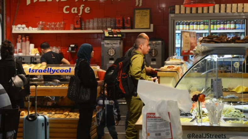 image Israeli solider and Arab man and woman
