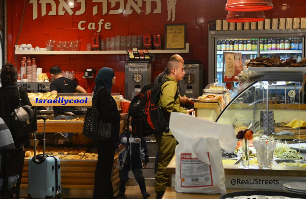 image Israeli solider and Arab man and woman