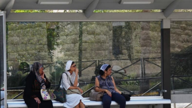 Muslim woman in Jerusalem at bus stop