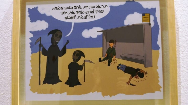 Israeli cartoon contest sponsored by Jerusalem Press Club and Holon cartoon on display Angel of Death