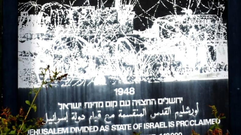 Section of sign with Jerusalem population in Yemin Moshe