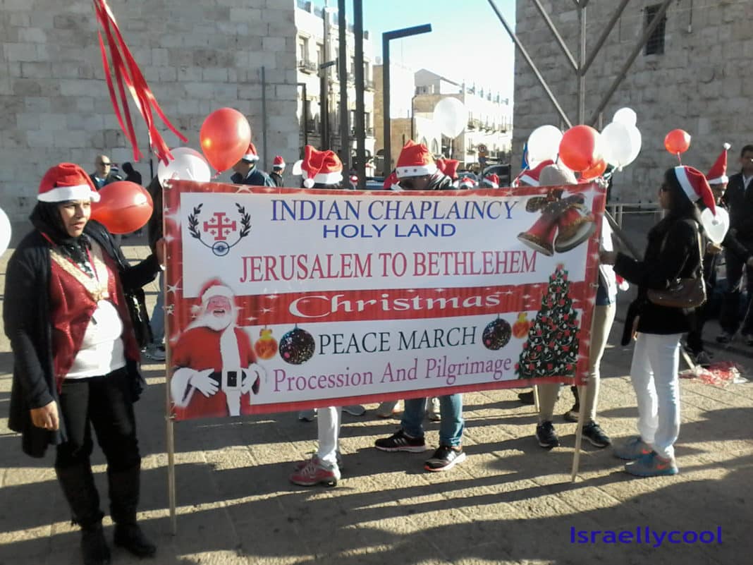 image Indian workers in Santa hats at Jaffa Gate