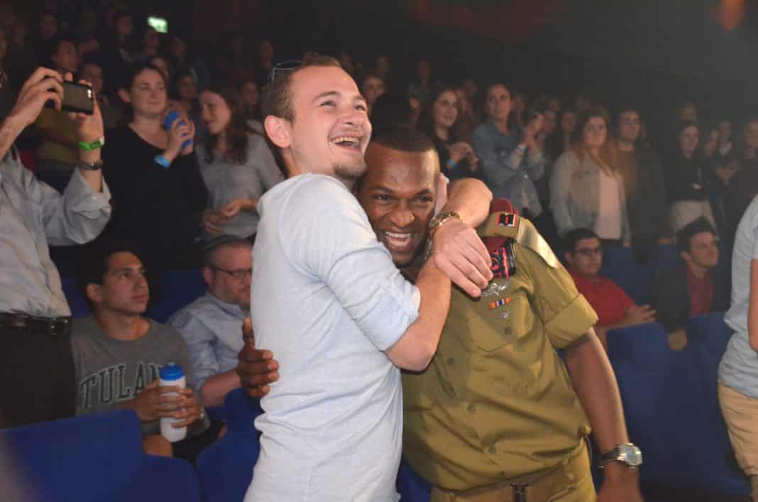 Mekonen gets hug from his former commander at film premiere in Jerusalem