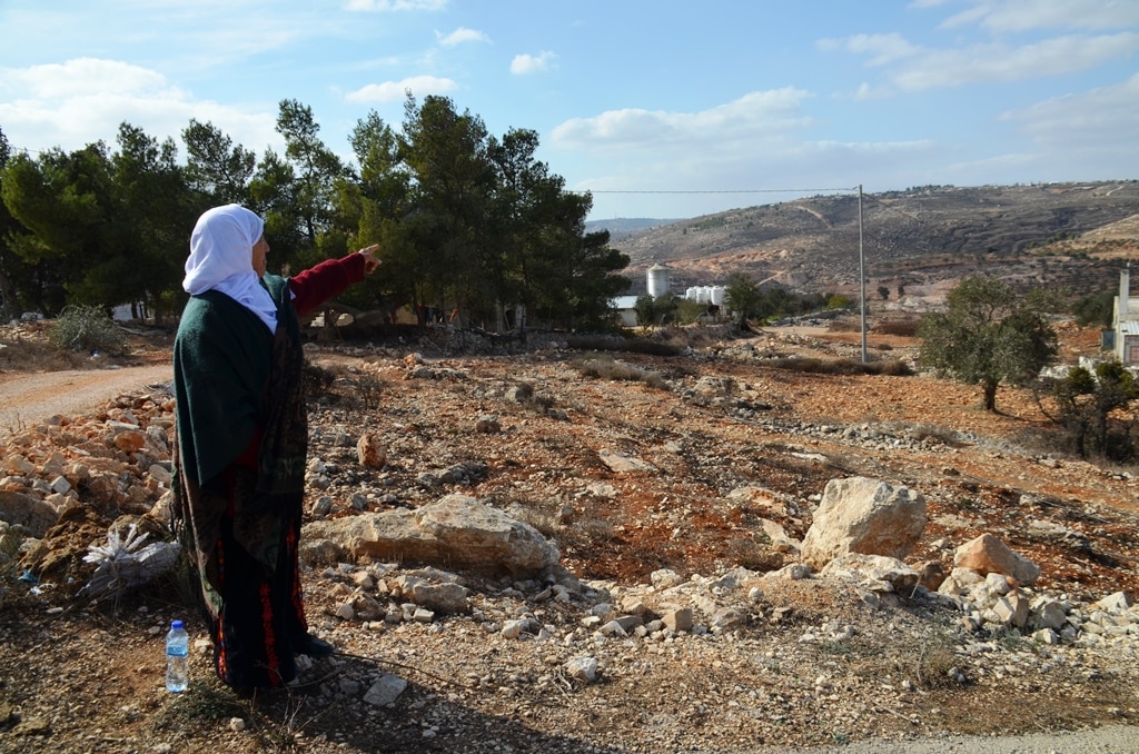 82 year old Arab woman points to her land in Amona for reports on Media Central trip of Ofra