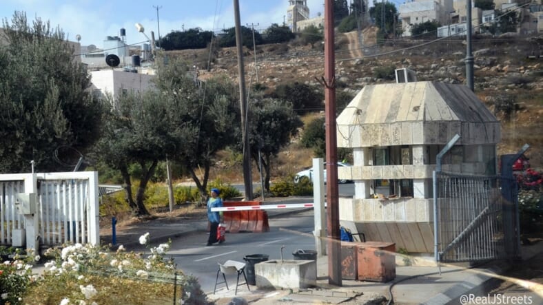 Entrance to Hevron where IDF soldier is in cement protected cage