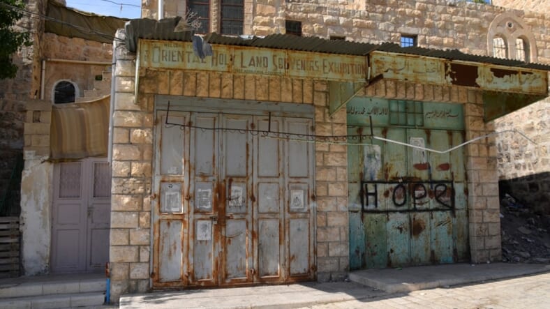 Shuttered quiet deserted street in Hebron usually seen in media