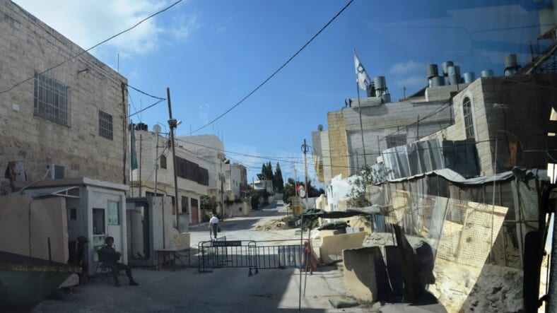 Hevron street with Israel solider watching