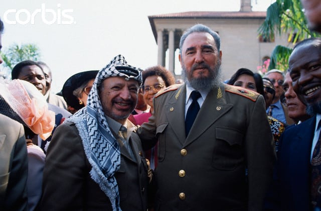 10 Jun 1994, Johannesburg, South Africa --- PLO leader Yasser Arafat and Cuban dictator Fidel Castro at the inauguration ceremony for South African president Nelson Mandela. --- Image by © Peter Turnley/Corbis