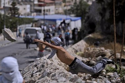 palestinian protester rock