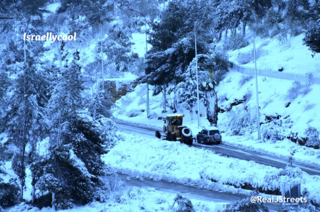 Snow plow Jerusalem, Israel clearing road 